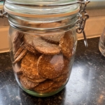 Peanut butter dog biscuits in a glass kilner jar